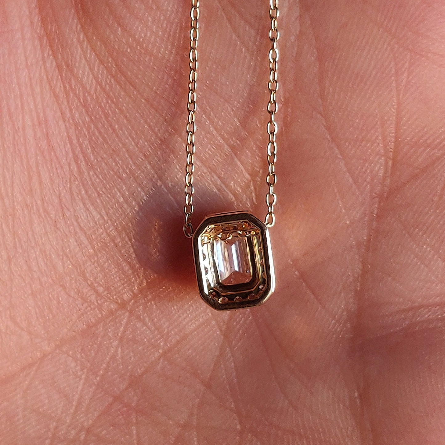 East West Emerald Solitaire Bezel Pendant