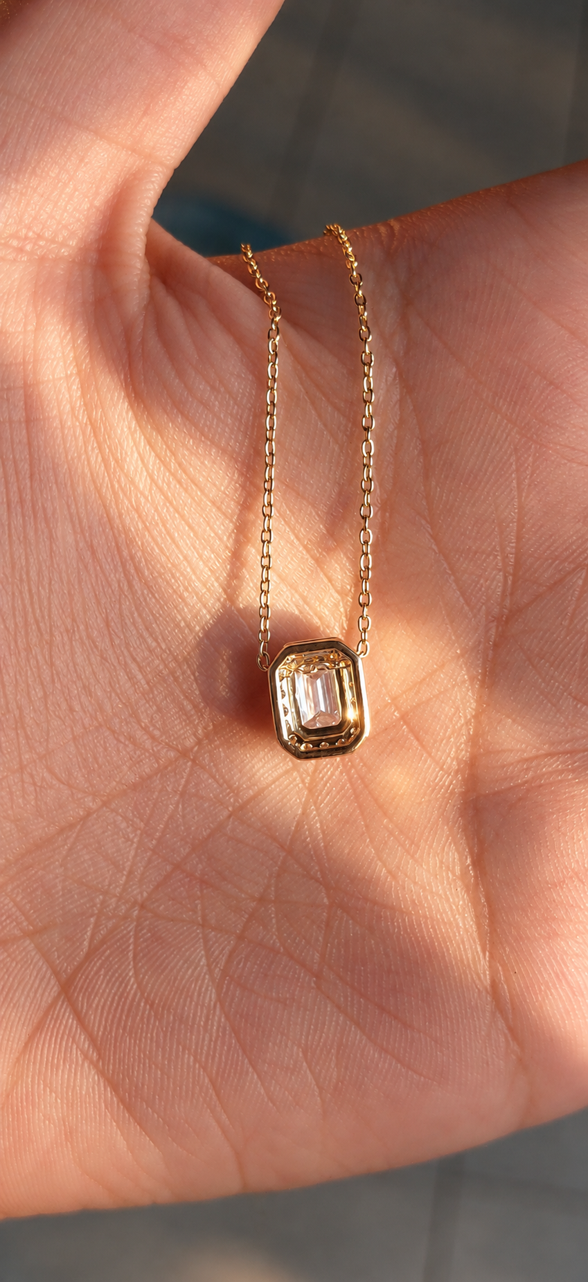 East West Emerald Solitaire Bezel Pendant