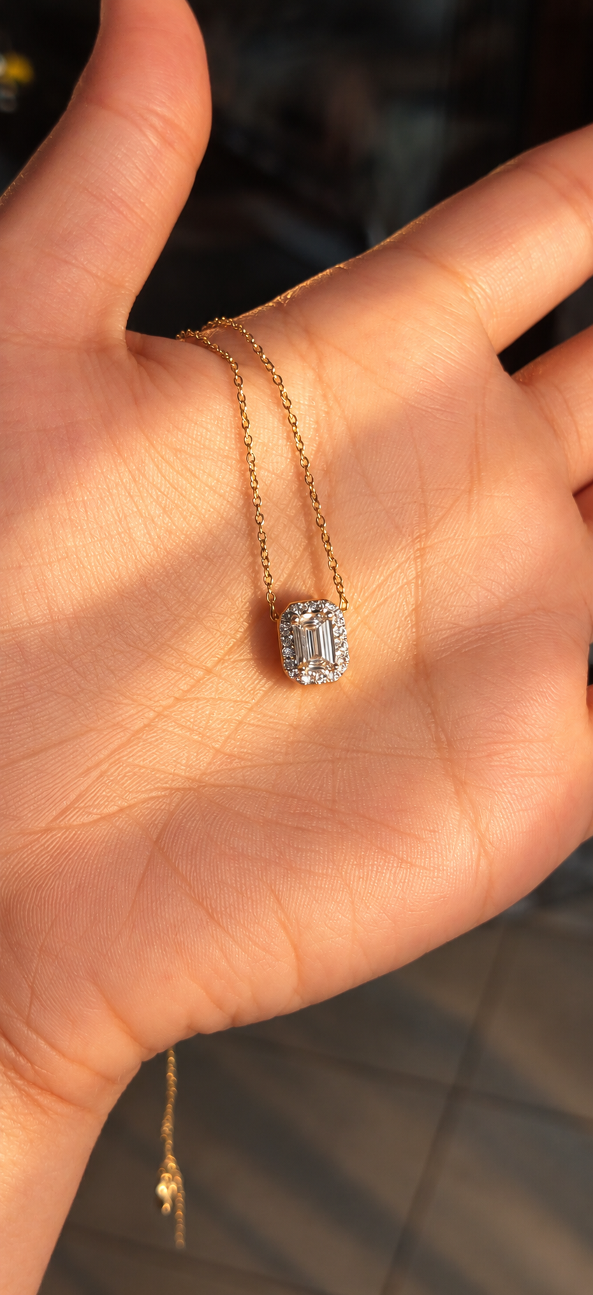 East West Emerald Solitaire Bezel Pendant